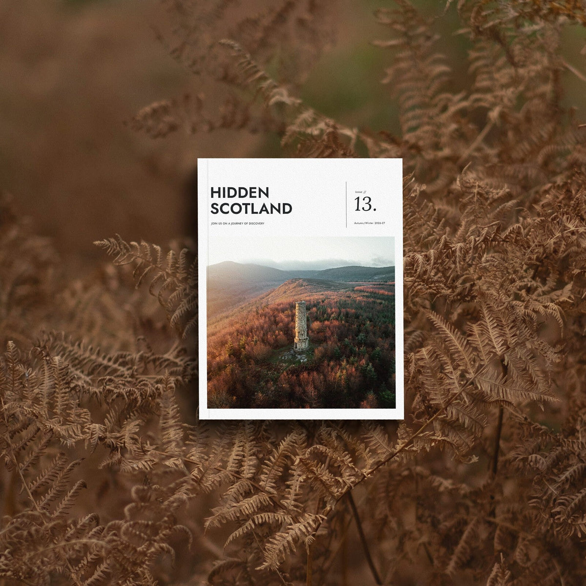 Hidden Scotland Magazine Issue 13 cover, Autumn/Winter 2026-27, lying in autumn bracken
