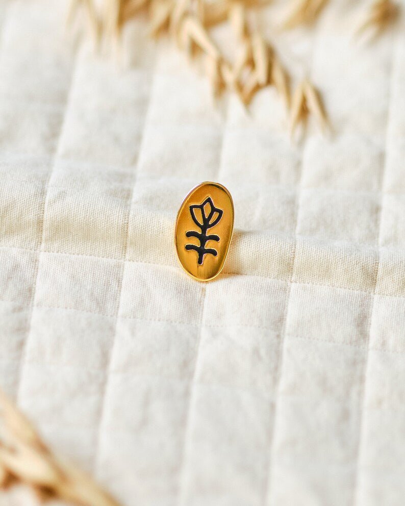Gold Oval Folk Art Flower Enamel Pin Badge by Claire Paul - Hidden Scotland